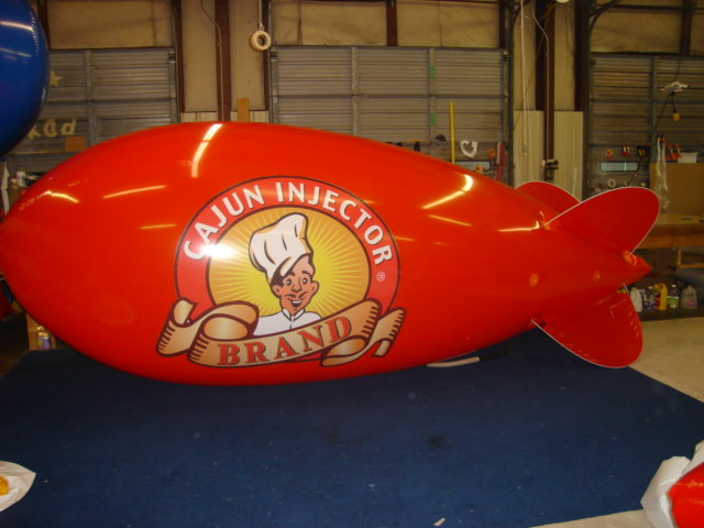 Cajun Injector logo on red color helium trade show blimp