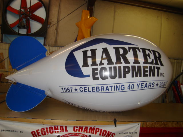 advertising blimp with Harter equipment logo