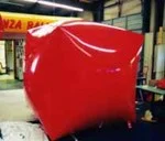 Las Vegas trade show balloon - giant red cube shape helium inflatable.